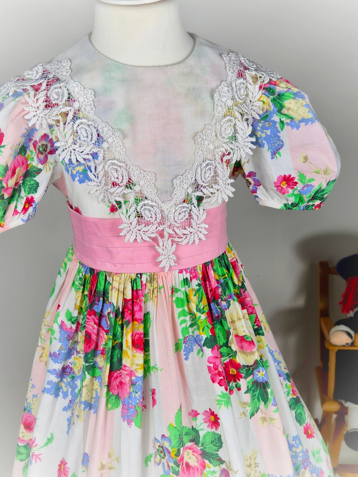 7-8 years. Floral vintage Ruth of Carolina dress with large white bib and puff sleeves