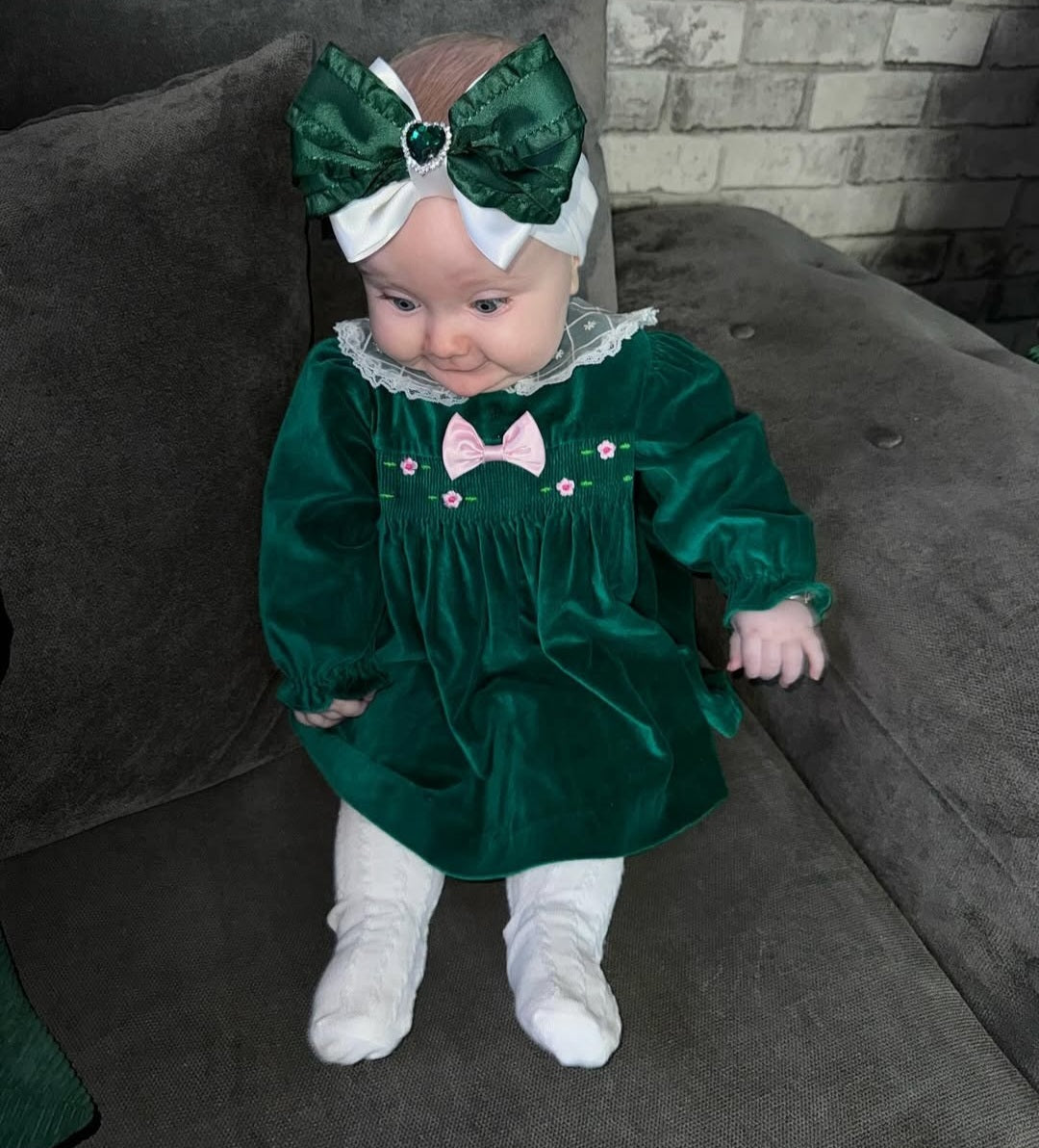 12 months. Emerald green velour dress with lace collar and pink details