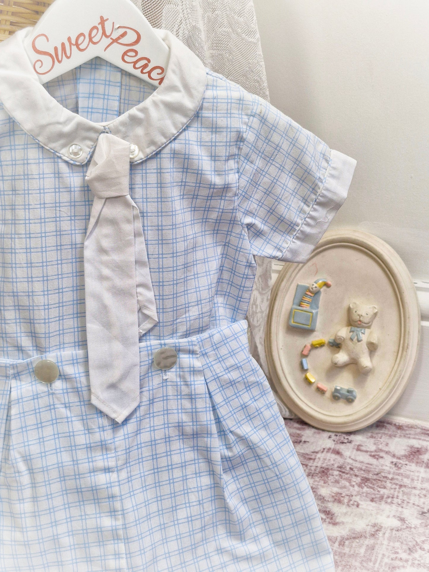 Best fit 12-18 months. Two piece shirt and shorts set. Blue and white checkered
