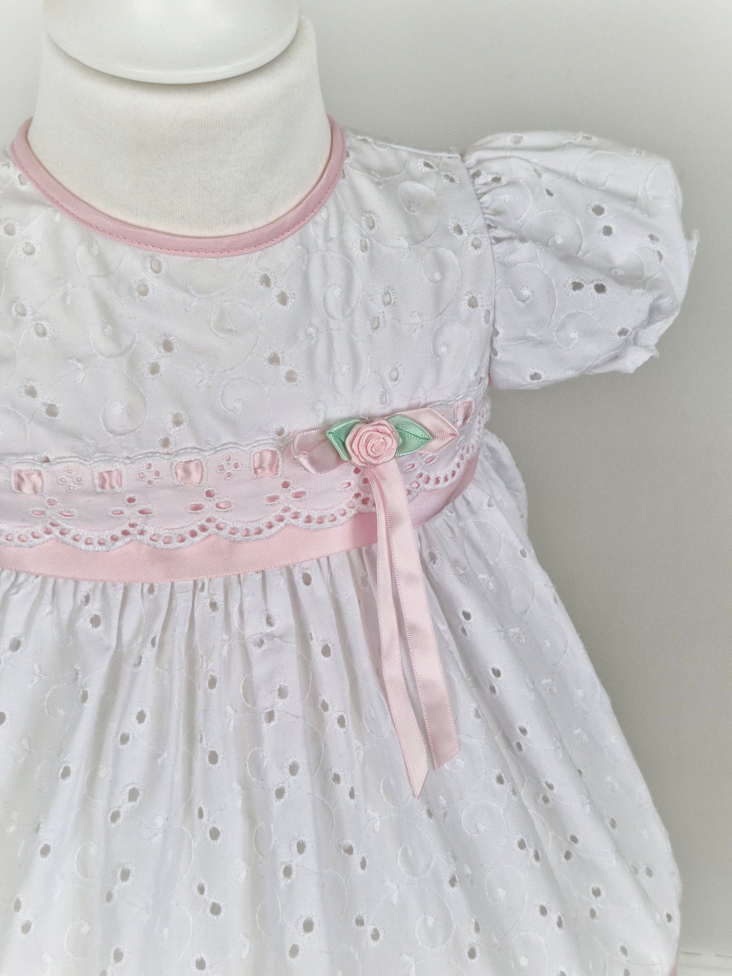 18 months. White broderie anglais dress with pink ribbon
