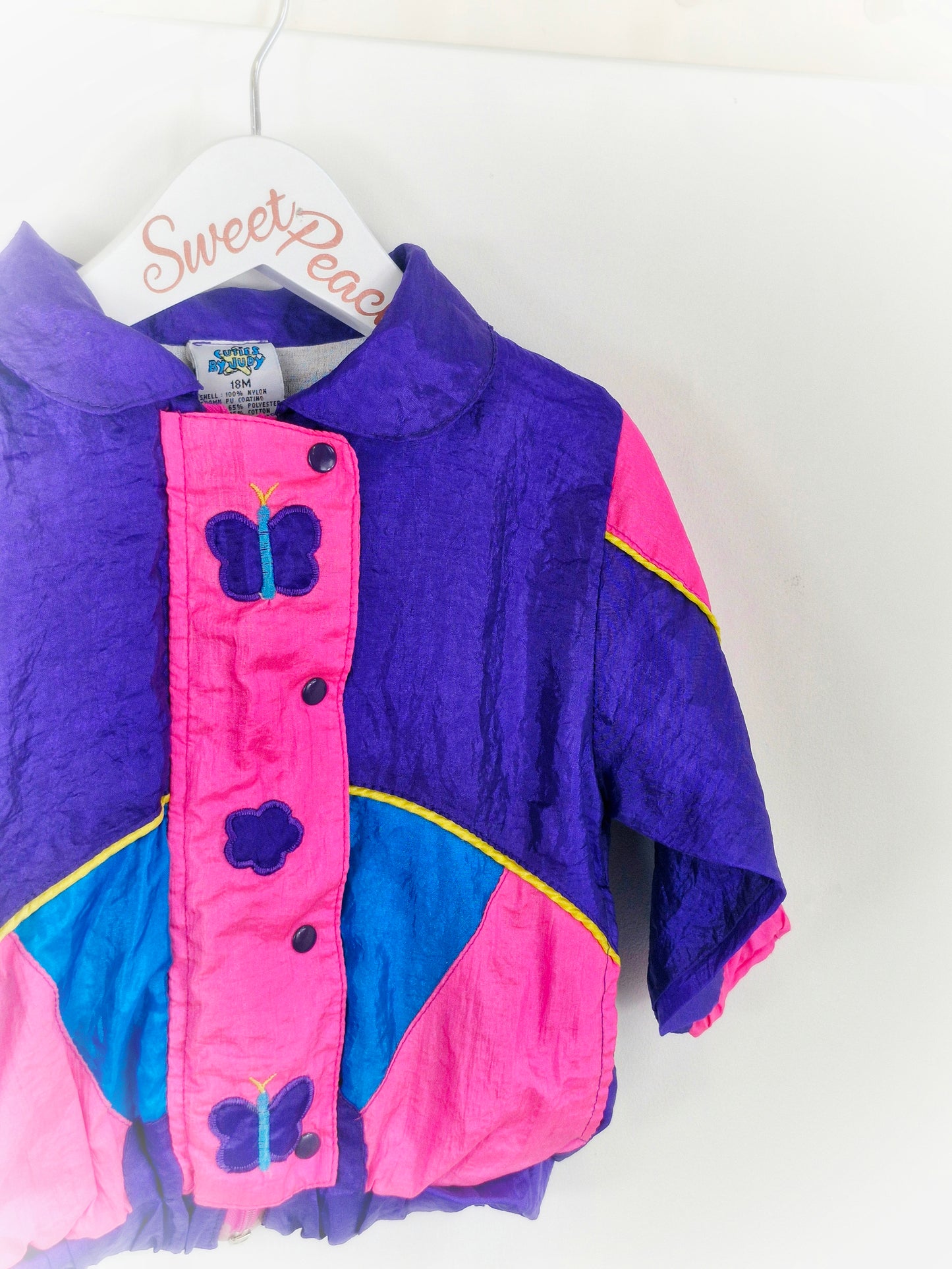 18 months. Purple and hot pink wind breaker with butterflies from Cuties by Judy