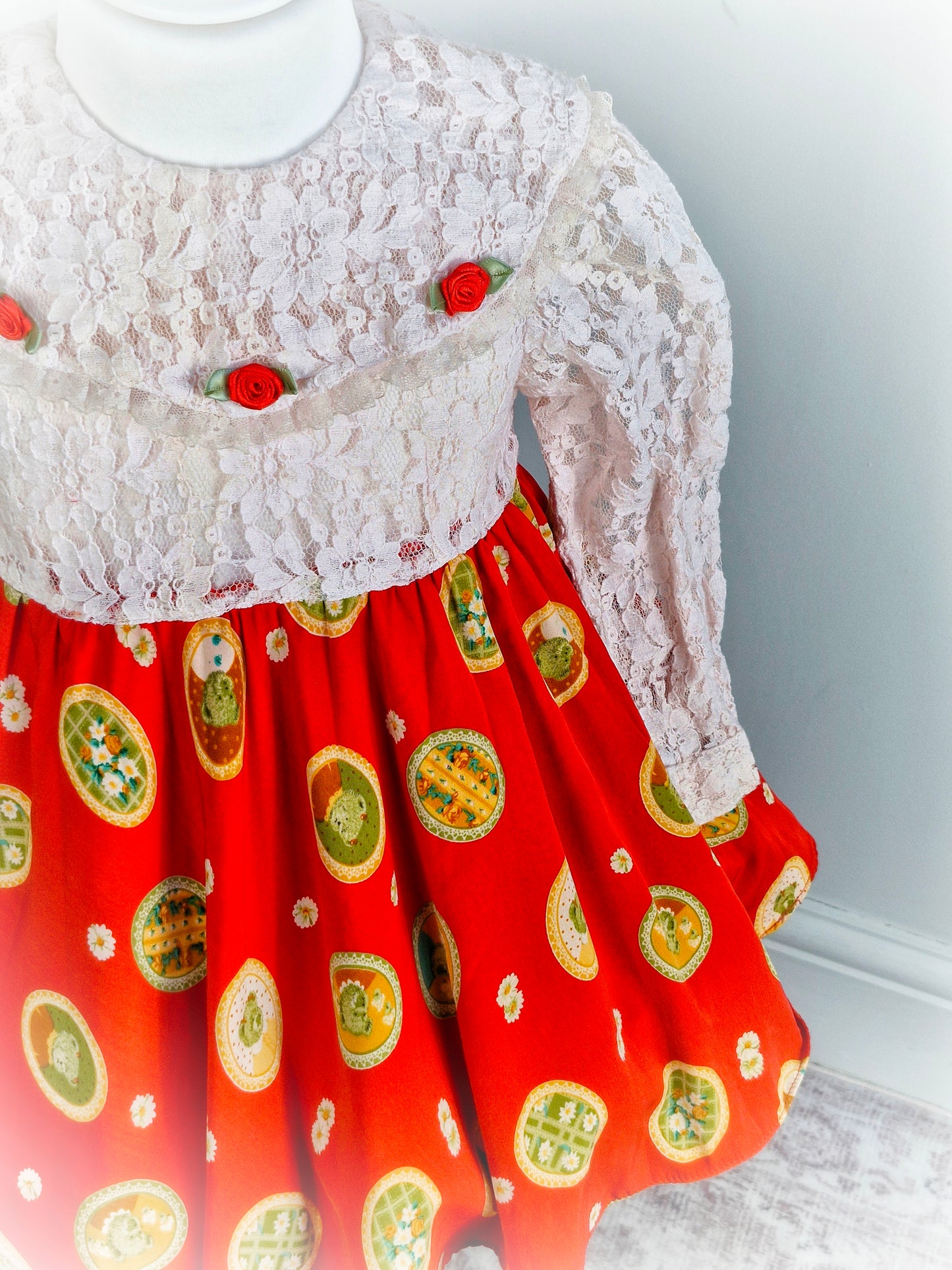 2-3 years. Vintage inspired dress, white lace top and sleeves with full circle red skirt featuring cute teddy bears