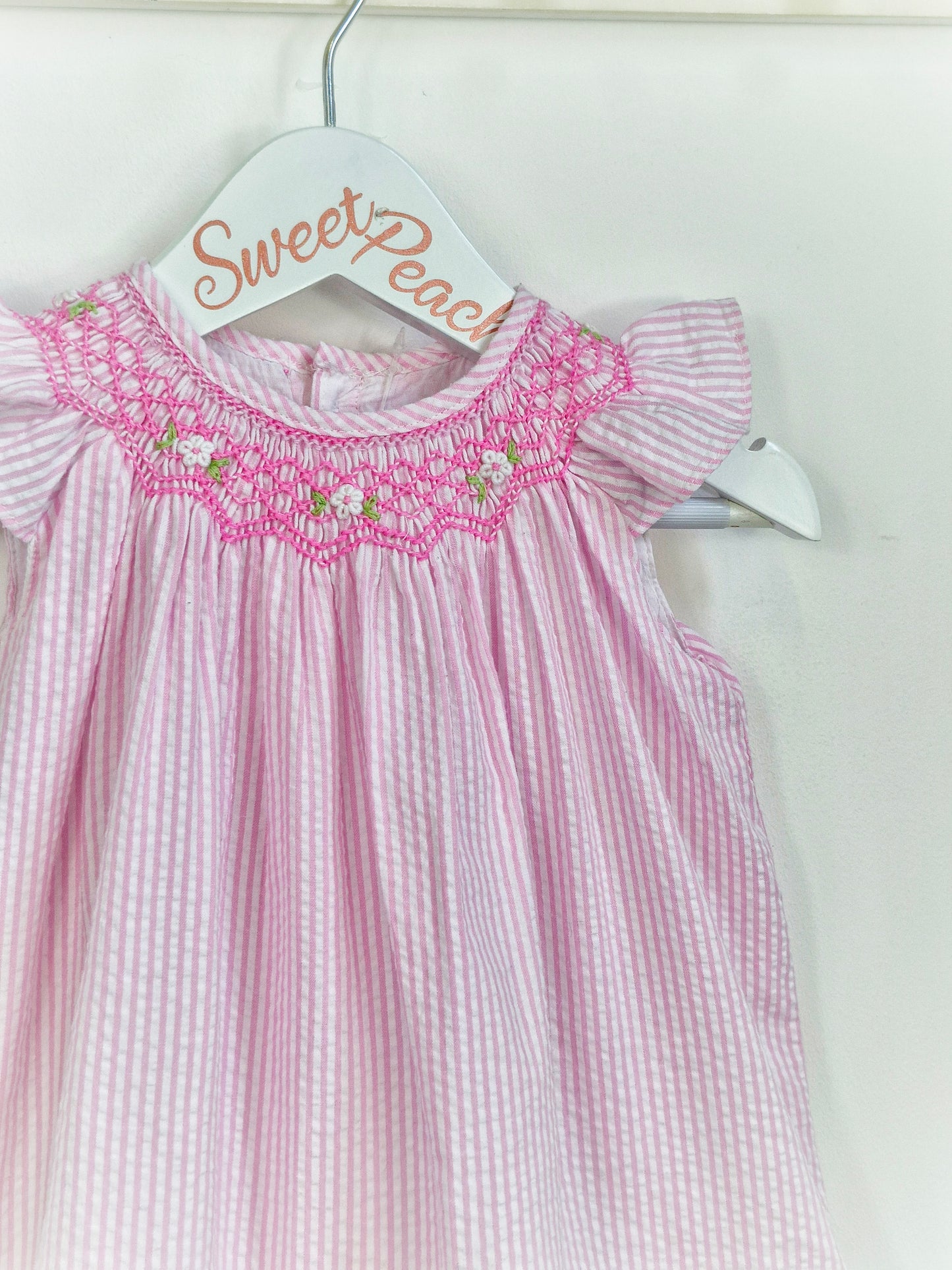 9-12 months. Vintage inspired pink and white striped dress with pink smock collar and flutter sleeves