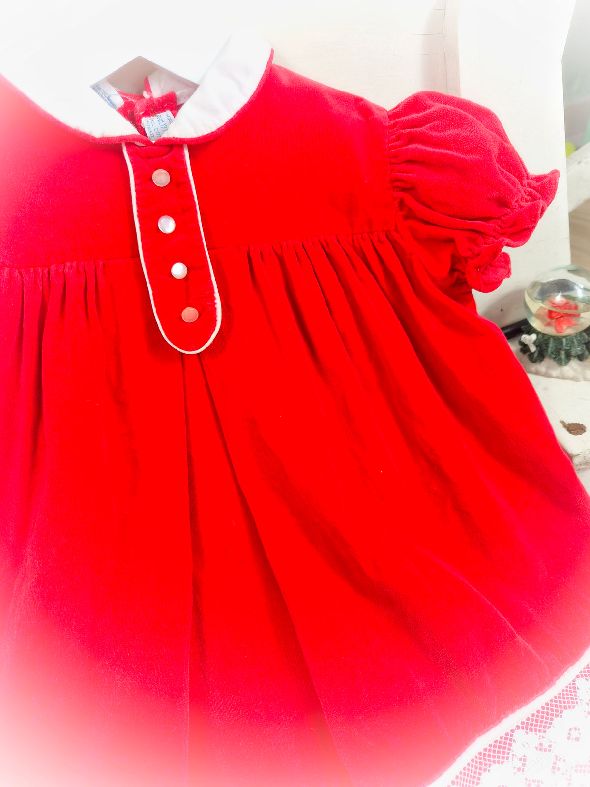 12-18 months. Red vintage velvet dress by Cherubs with white collar, buttons and lace hem