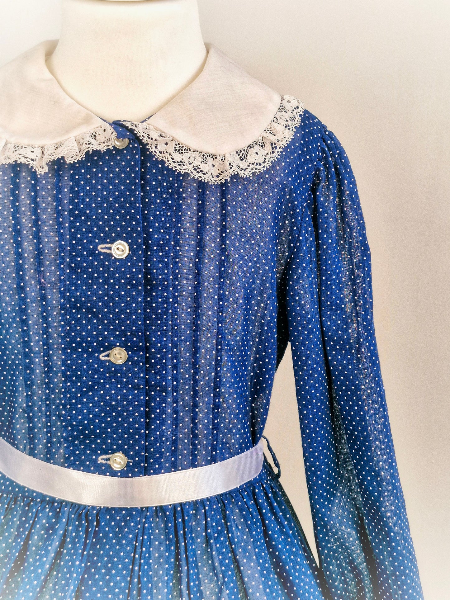 Navy dress with white polka dots, collar and lace. Best fit 6-7 years