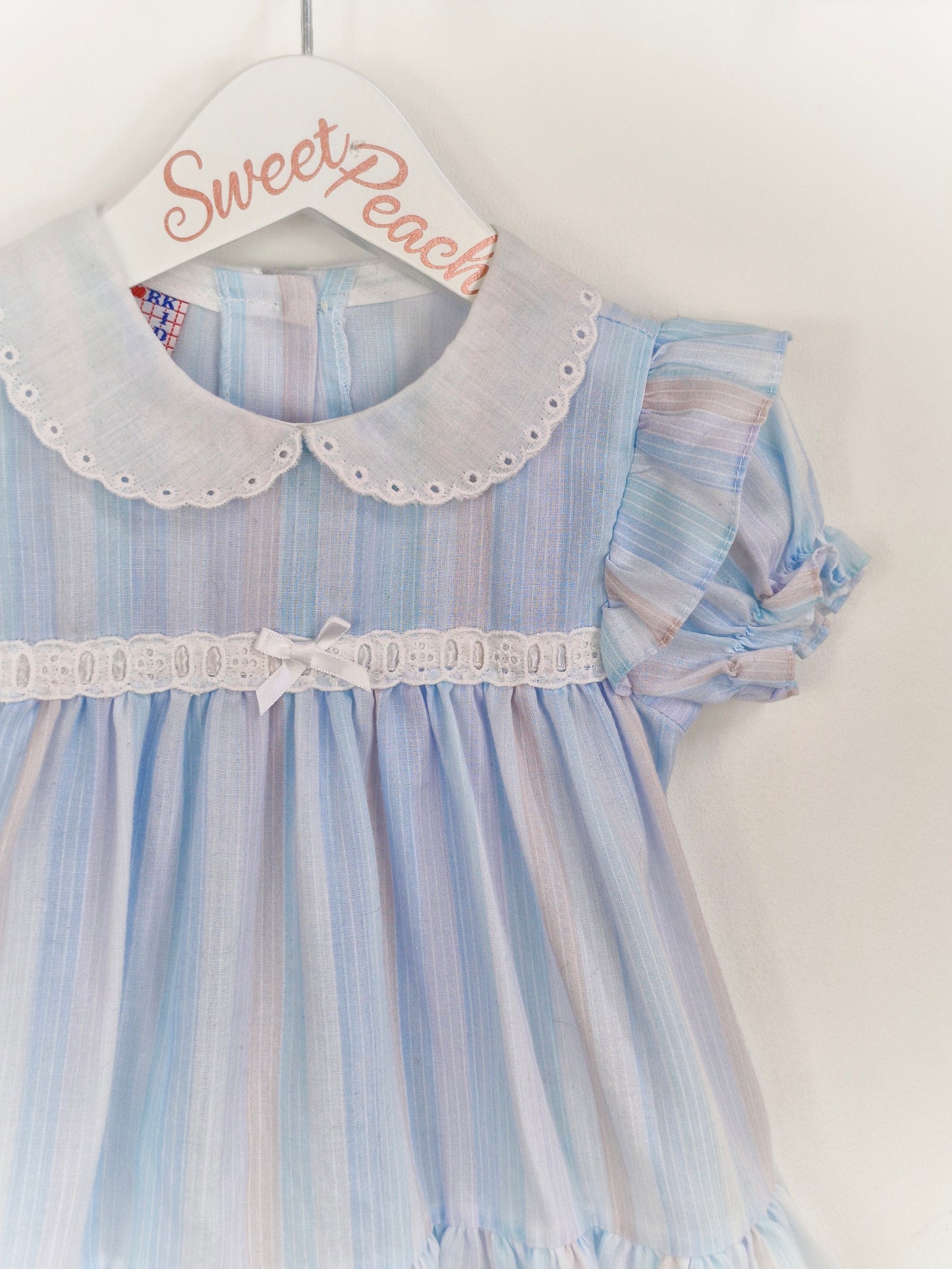 9-12 months. Pastel blue and lilac striped dress with white collar and details. New York Kids
