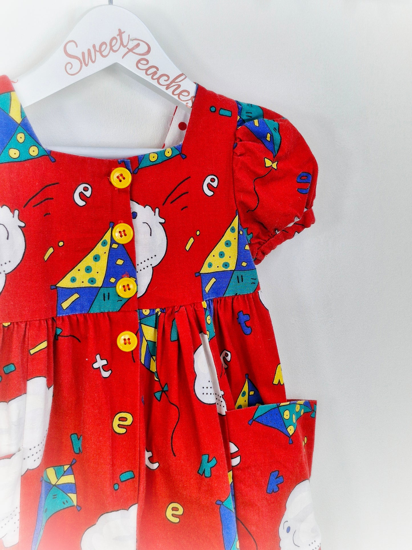 18 months. Red 90s Plum Pudding Ltd romper