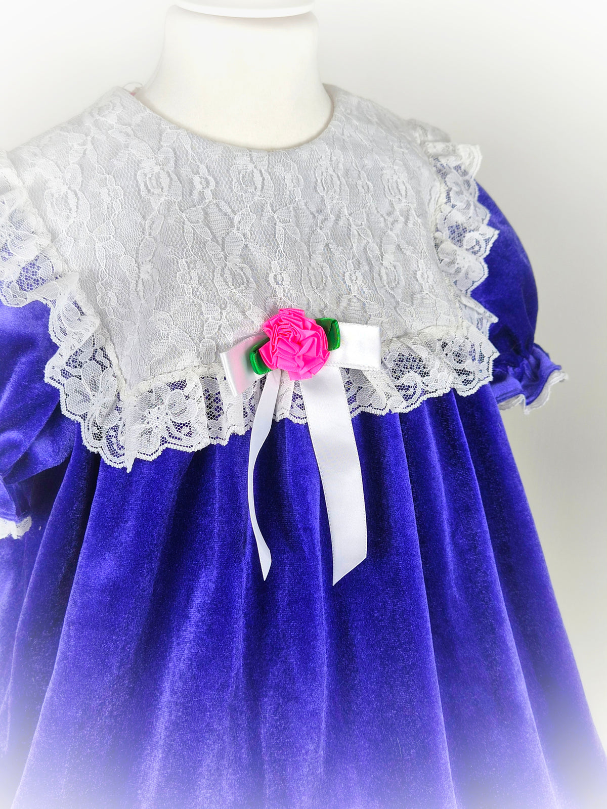 5-6 years. Purple velvet vintage dress from Roget USA with large white lace bib and pink floral centre