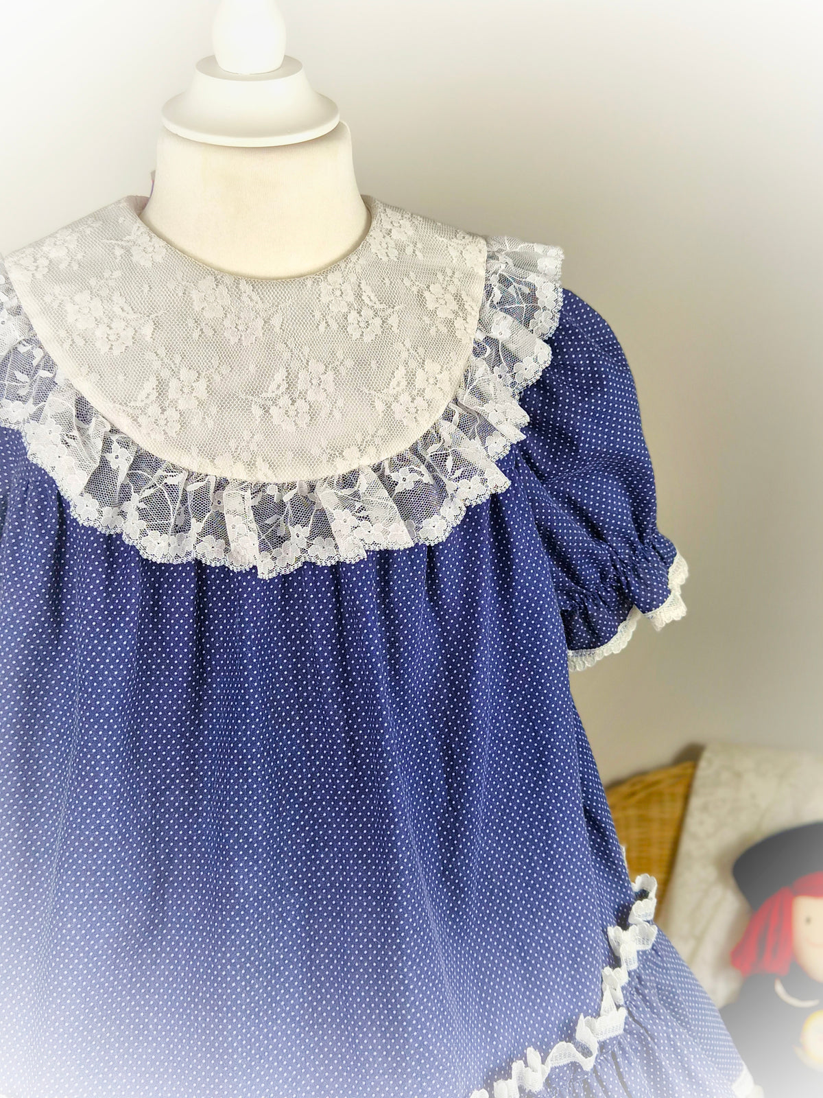 4-5 years. Navy polka dot vintage dress by Special Occasions with white lace bib and trim