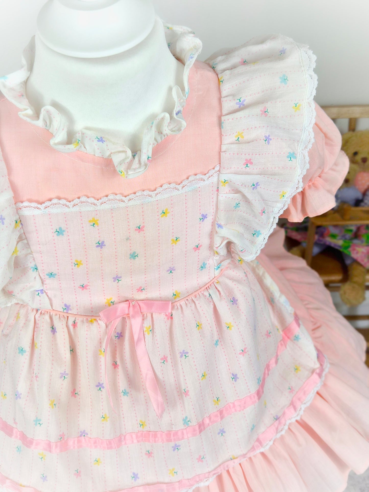 2 years. Pink vintage dress with puff sleeves and white apron, colourful butterfly print, satin pink ribbon and flutter shoulders