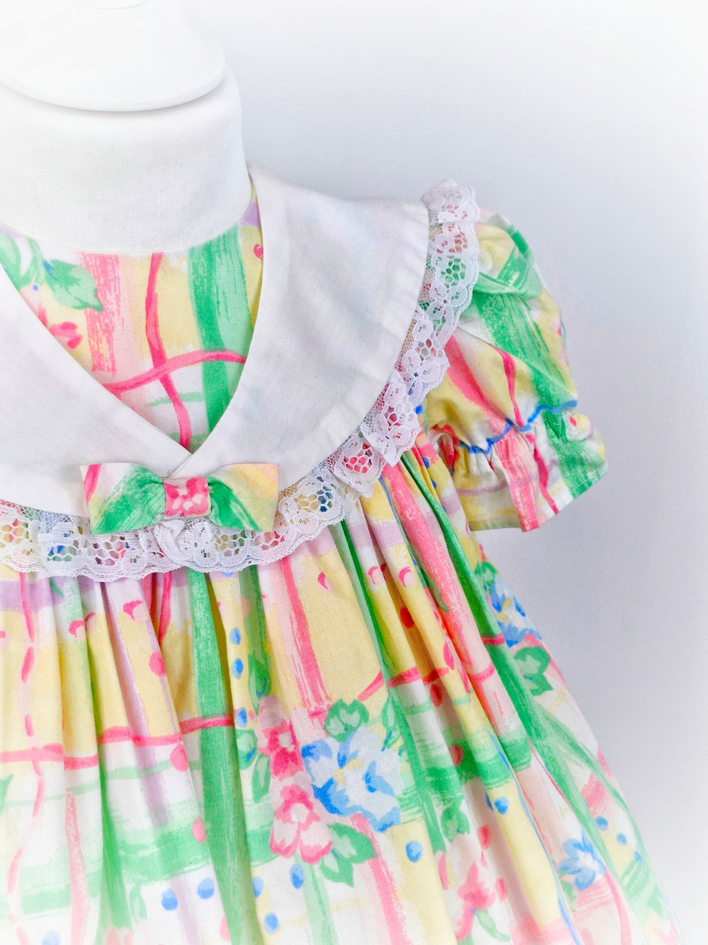 2 years. Handmade dress made with vintage fabric