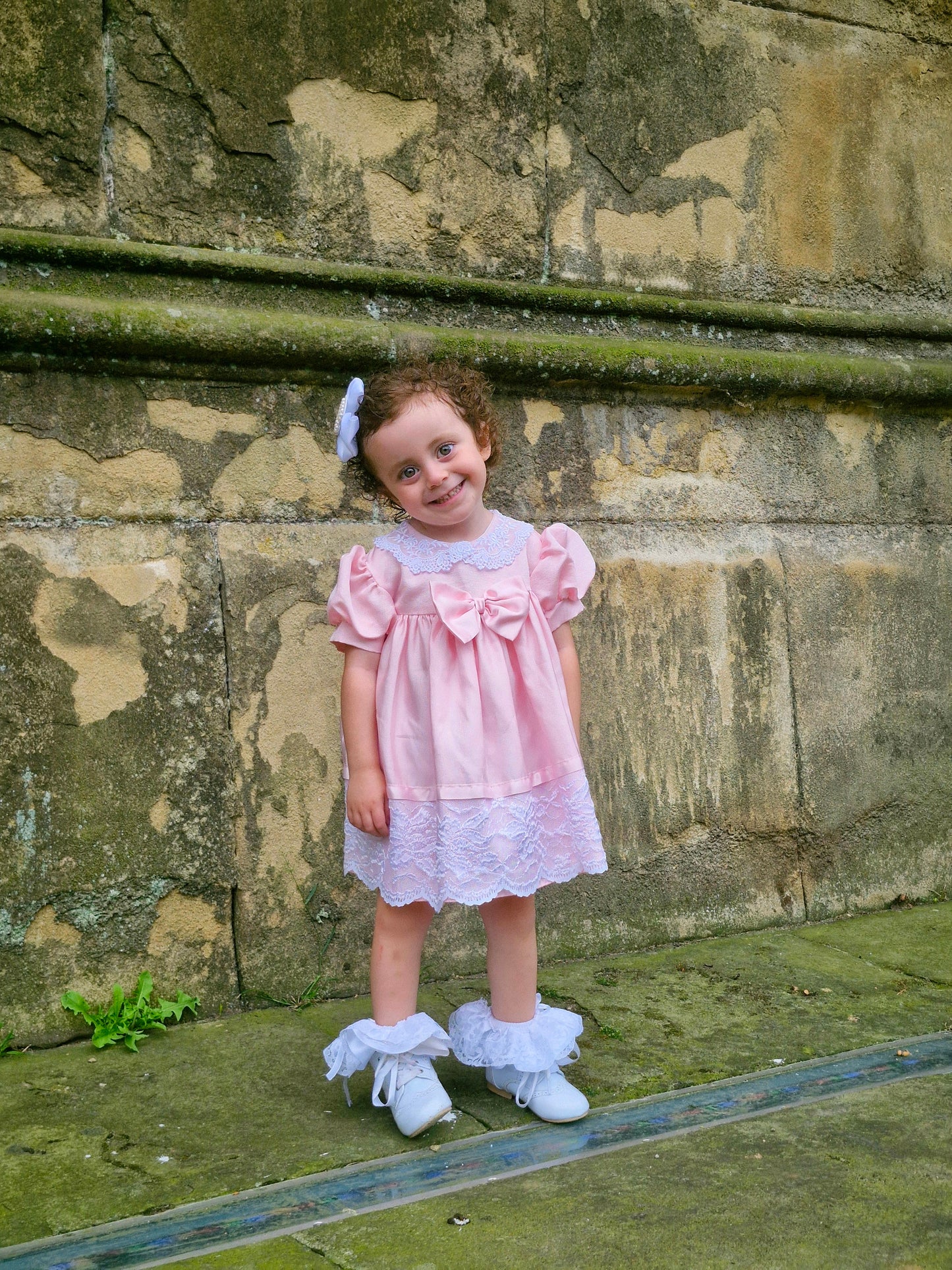 2 years. Pink Jolene with lace, ribbon and large bow