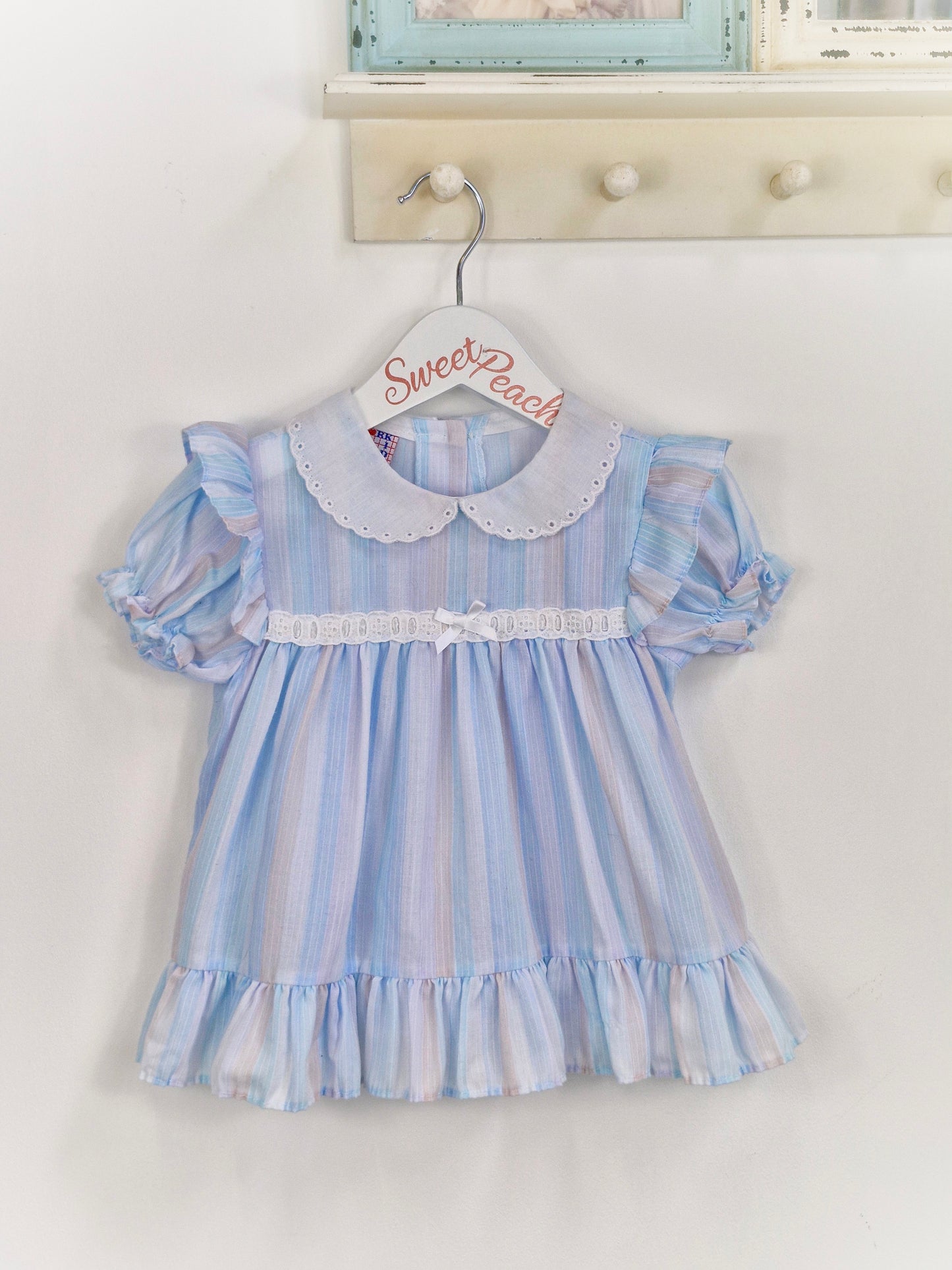 9-12 months. Pastel blue and lilac striped dress with white collar and details. New York Kids