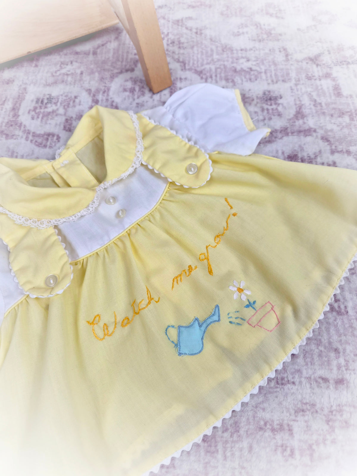 0-3 months. Lemon vintage dress with "watch me grow" embroidered. Small mark*