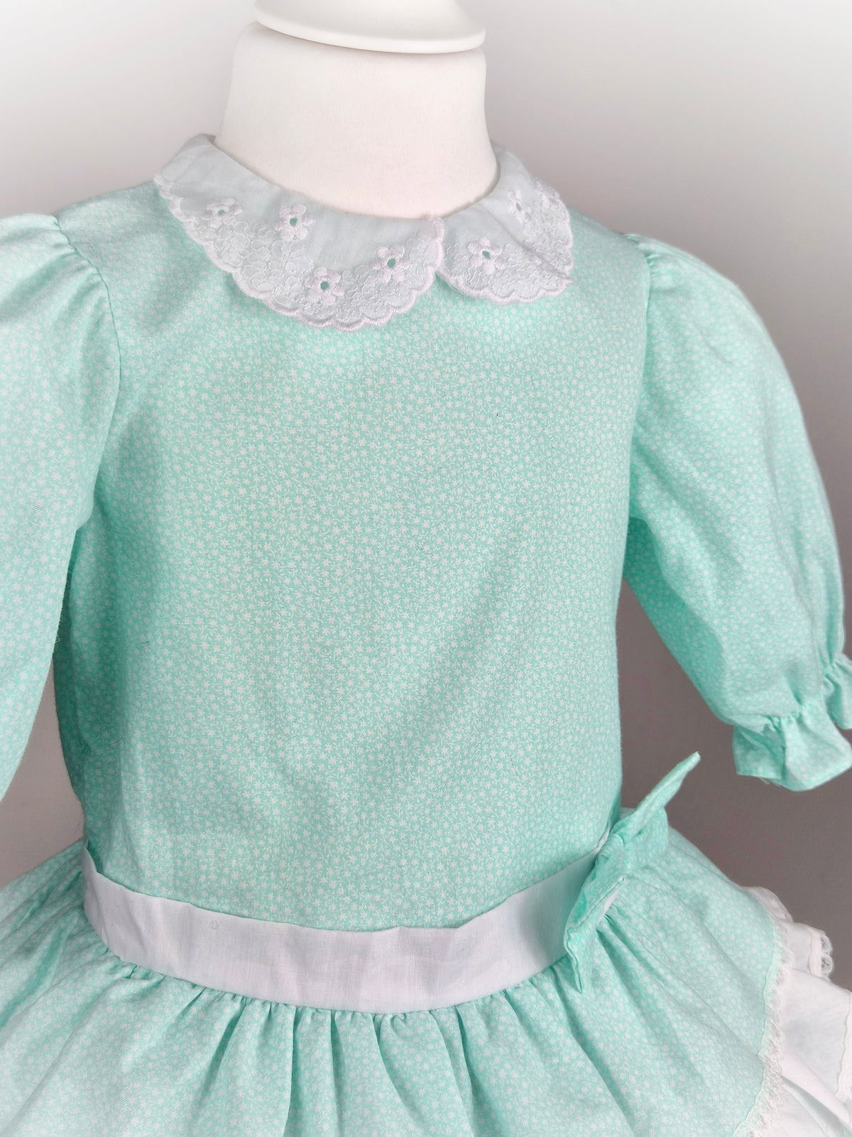 3 years. Mint and white vintage dress with tiered skirt and light floral print