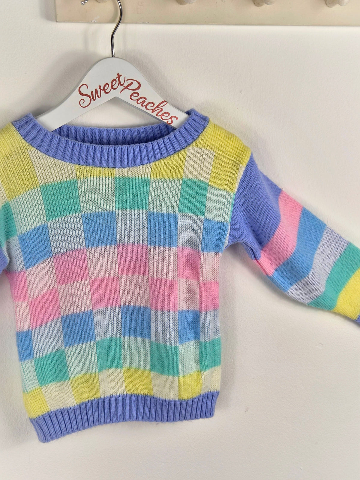 2 years. Mini Waves pastel checked and striped knit jumper