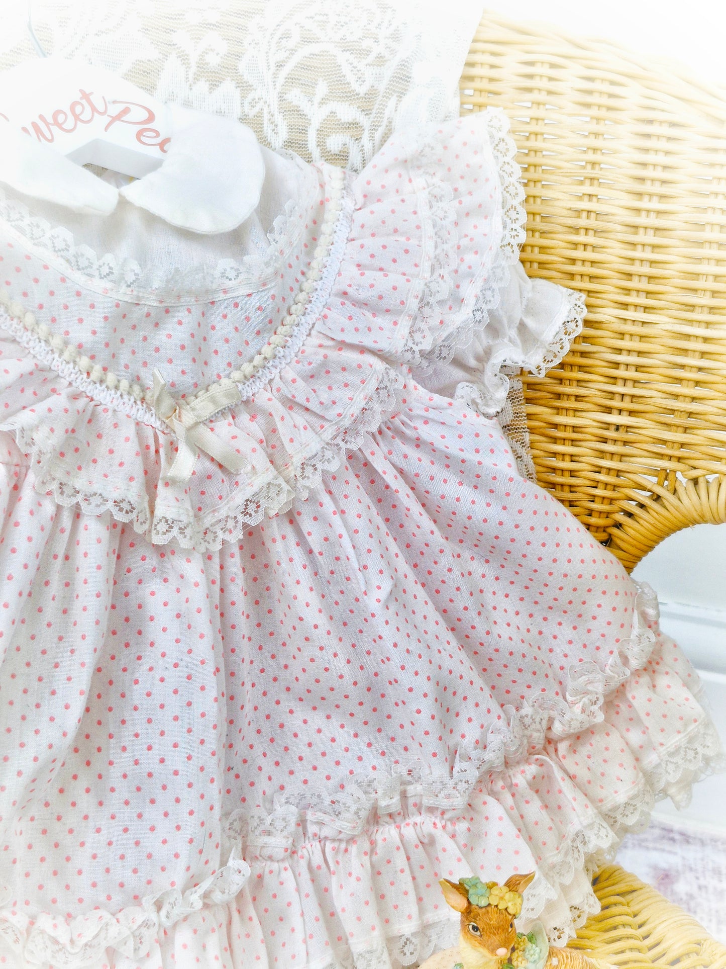 6-9 months. White frilly dress with pink polka dots