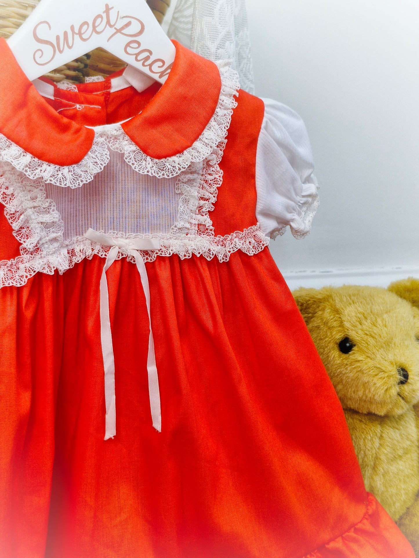 12-18 months. Red dress with white ribbon and lace. JC Penney