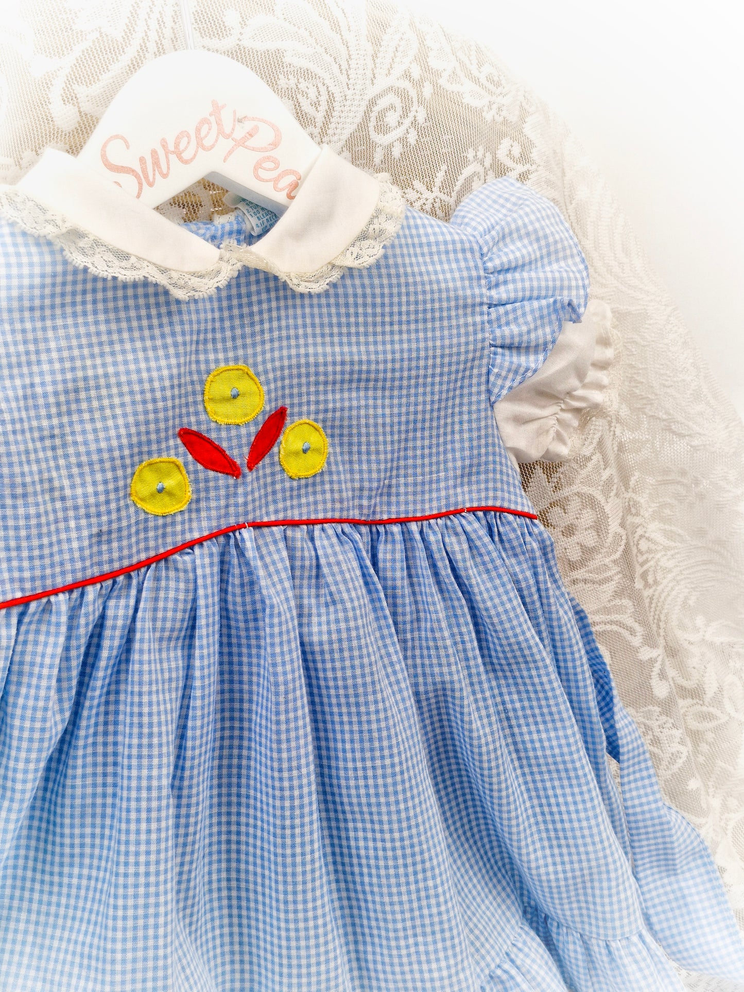 12 months. Blue and white gingham dress