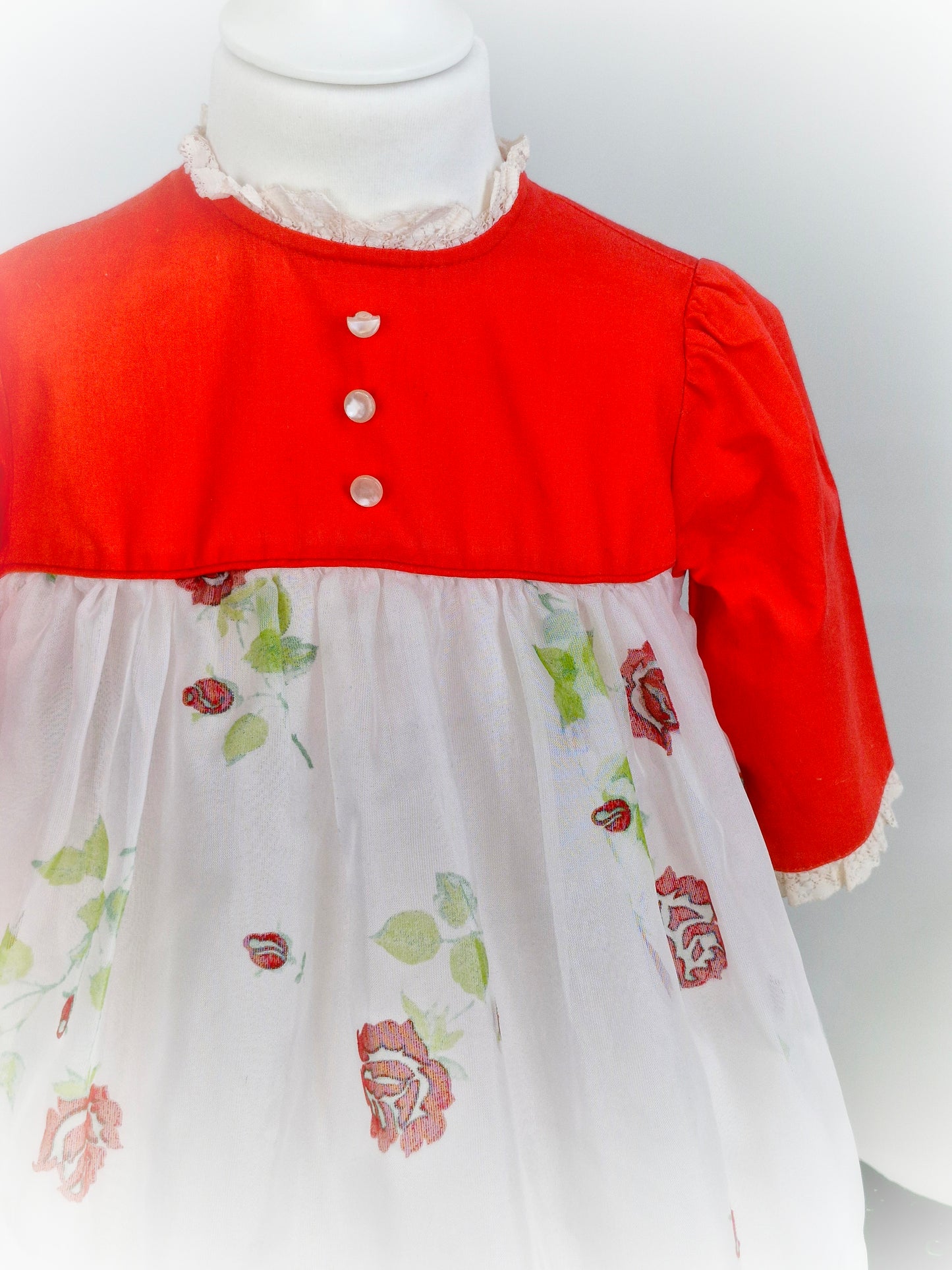 3 years. Red and white dress with flower print.