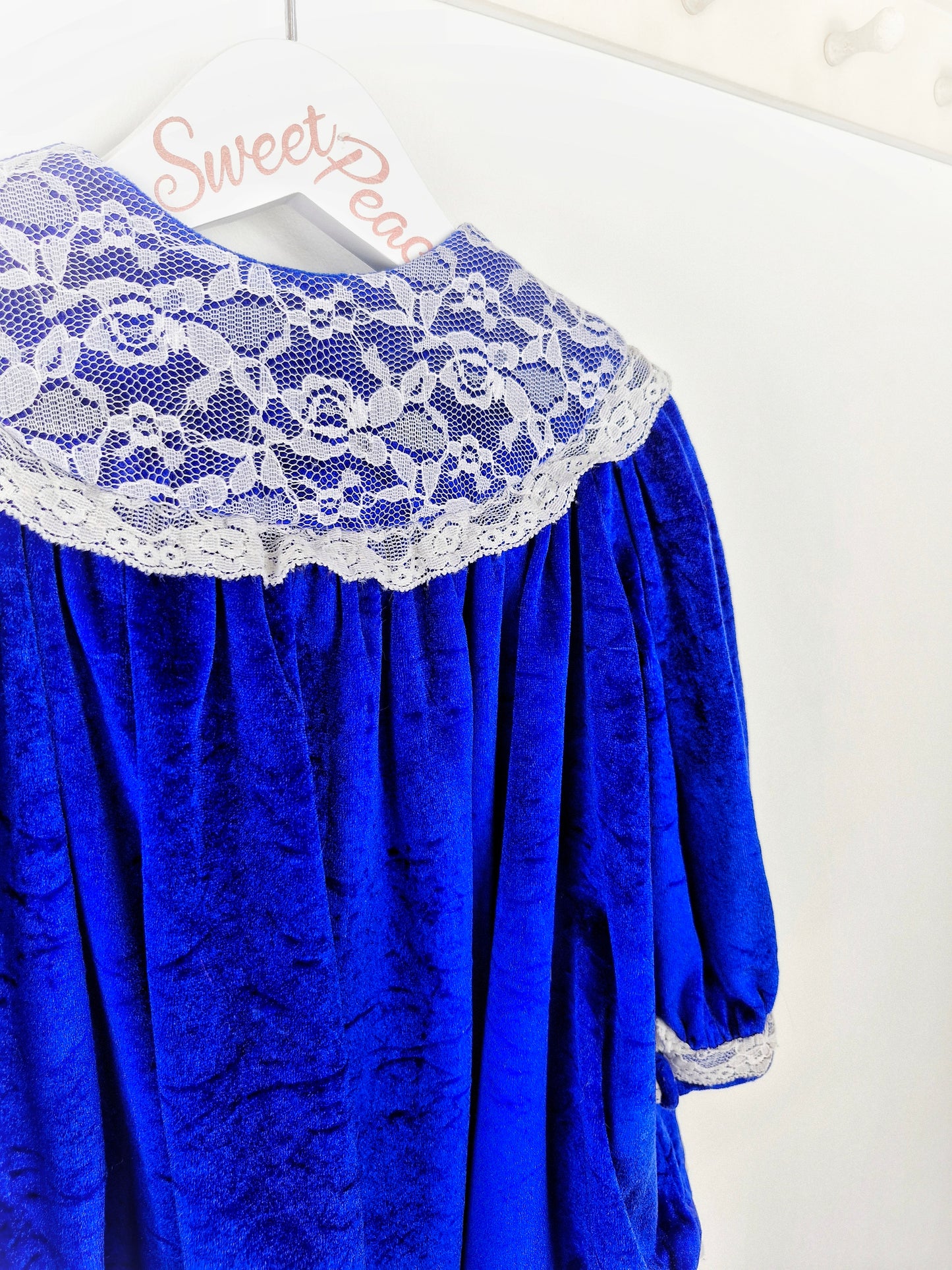 18-24 months. Royal blue velour dress with white lace bib and details