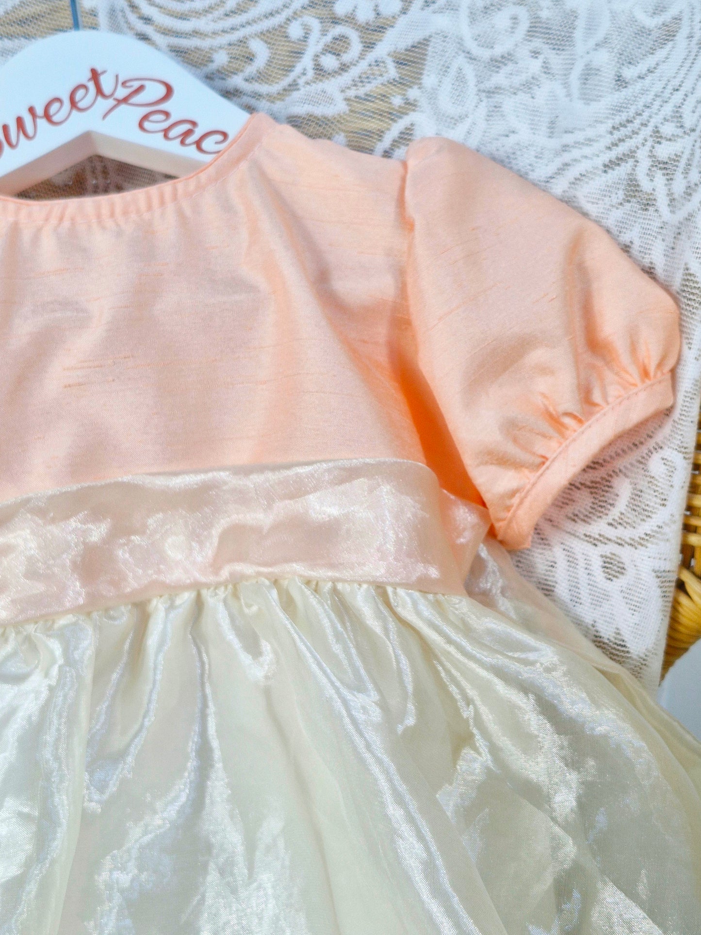 12 months. Peach and ivory taffeta dress with lovely buttons on back
