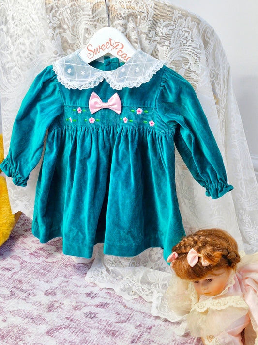 12 months. Emerald green velour dress with lace collar and pink details
