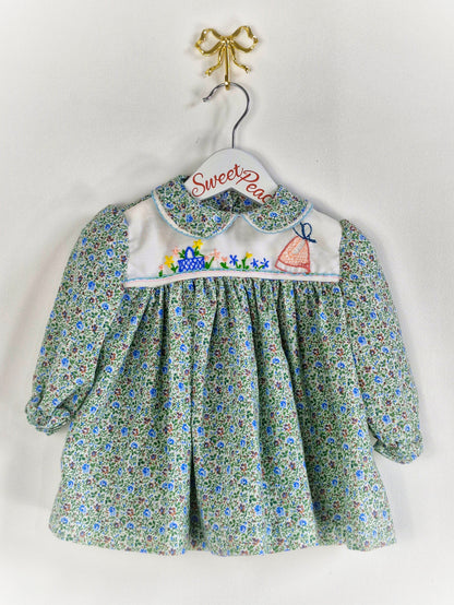 9-12 months. Collared, floral dress with embroidered details