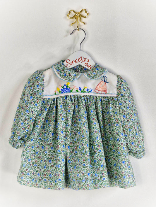 9-12 months. Collared, floral dress with embroidered details