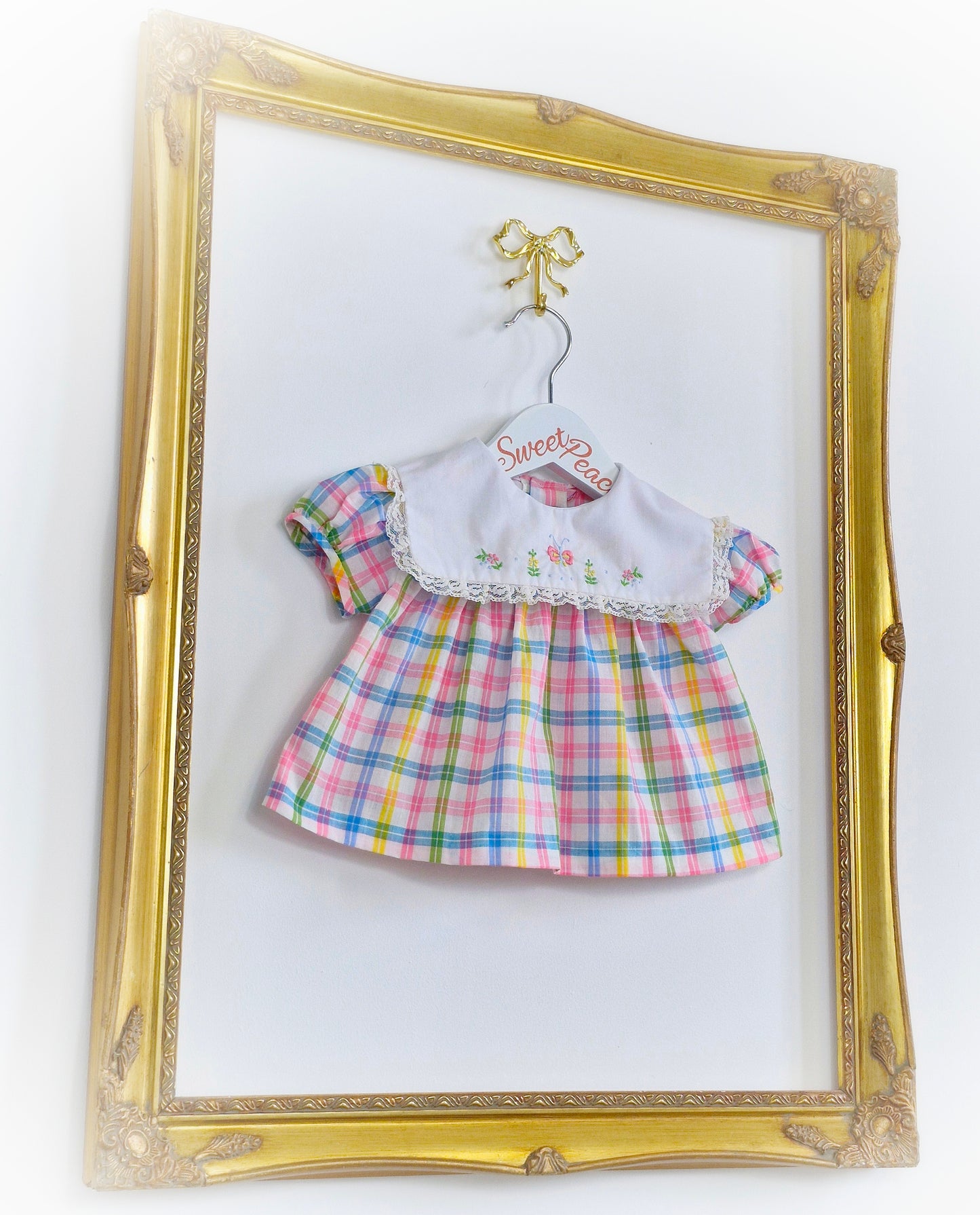 0-3 months. Pastel checked vintage baby dress with white bib, embroidered with flowers and a butterfly