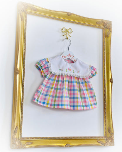 0-3 months. Pastel checked vintage baby dress with white bib, embroidered with flowers and a butterfly