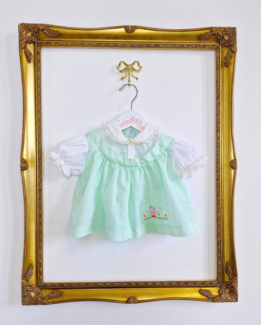 0-6 months. Mint and white vintage baby dress with embroidered ducks from Cherubs