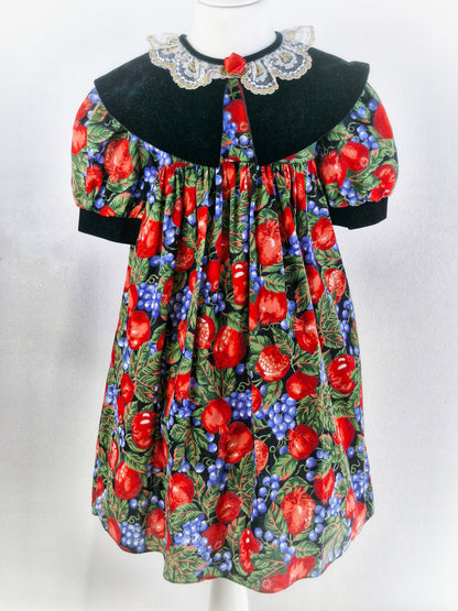 5 years. Vintage dress with beautiful fruit print, large black velvet bib with white lace collar