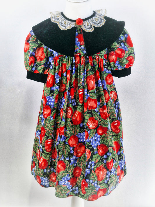 5 years. Vintage dress with beautiful fruit print, large black velvet bib with white lace collar