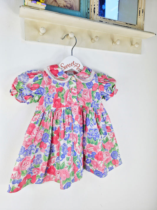 12 months. Fruit and floral print dress with buttons down the front and double collar
