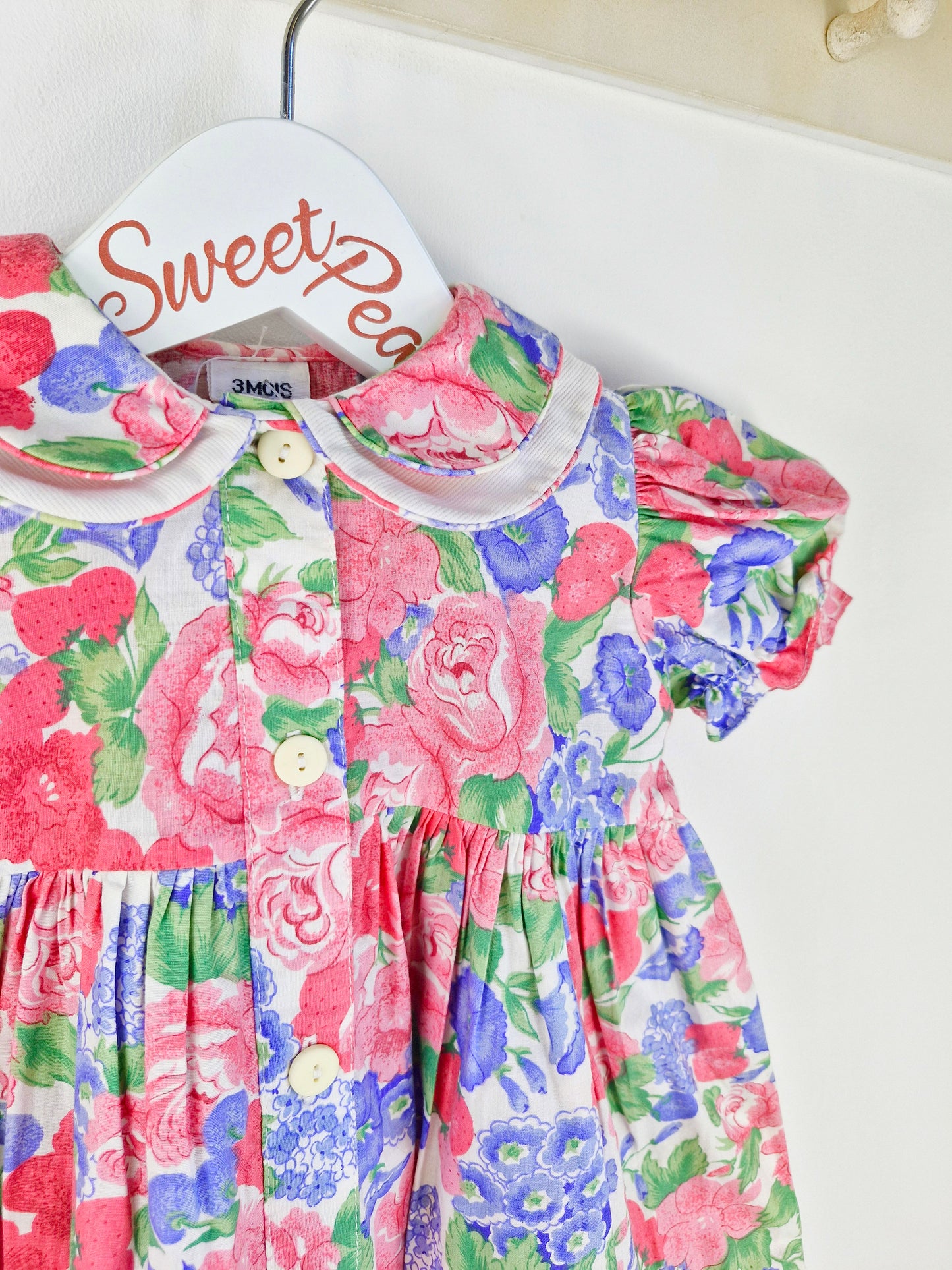 12 months. Fruit and floral print dress with buttons down the front and double collar