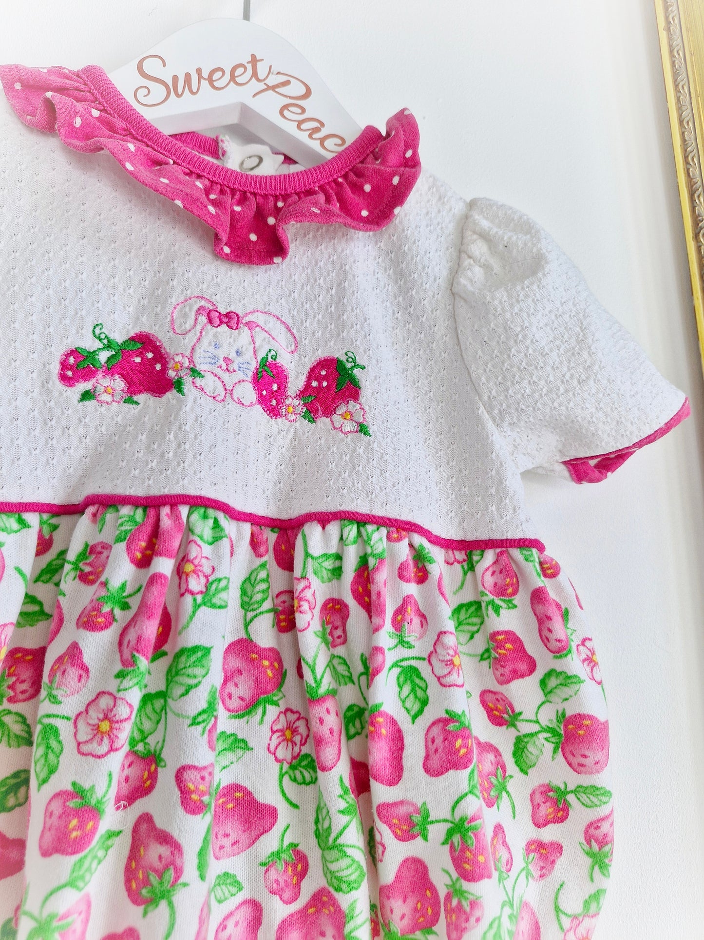 9-12 months. Healthtex romper with strawberry print, embroidered bunny and pink polka dot collar