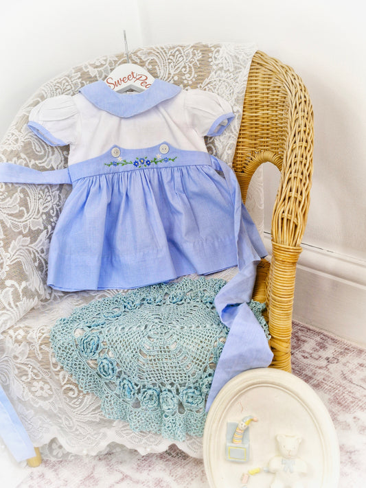 9-12 months. Blue and white dress with collar and embroidered flowers