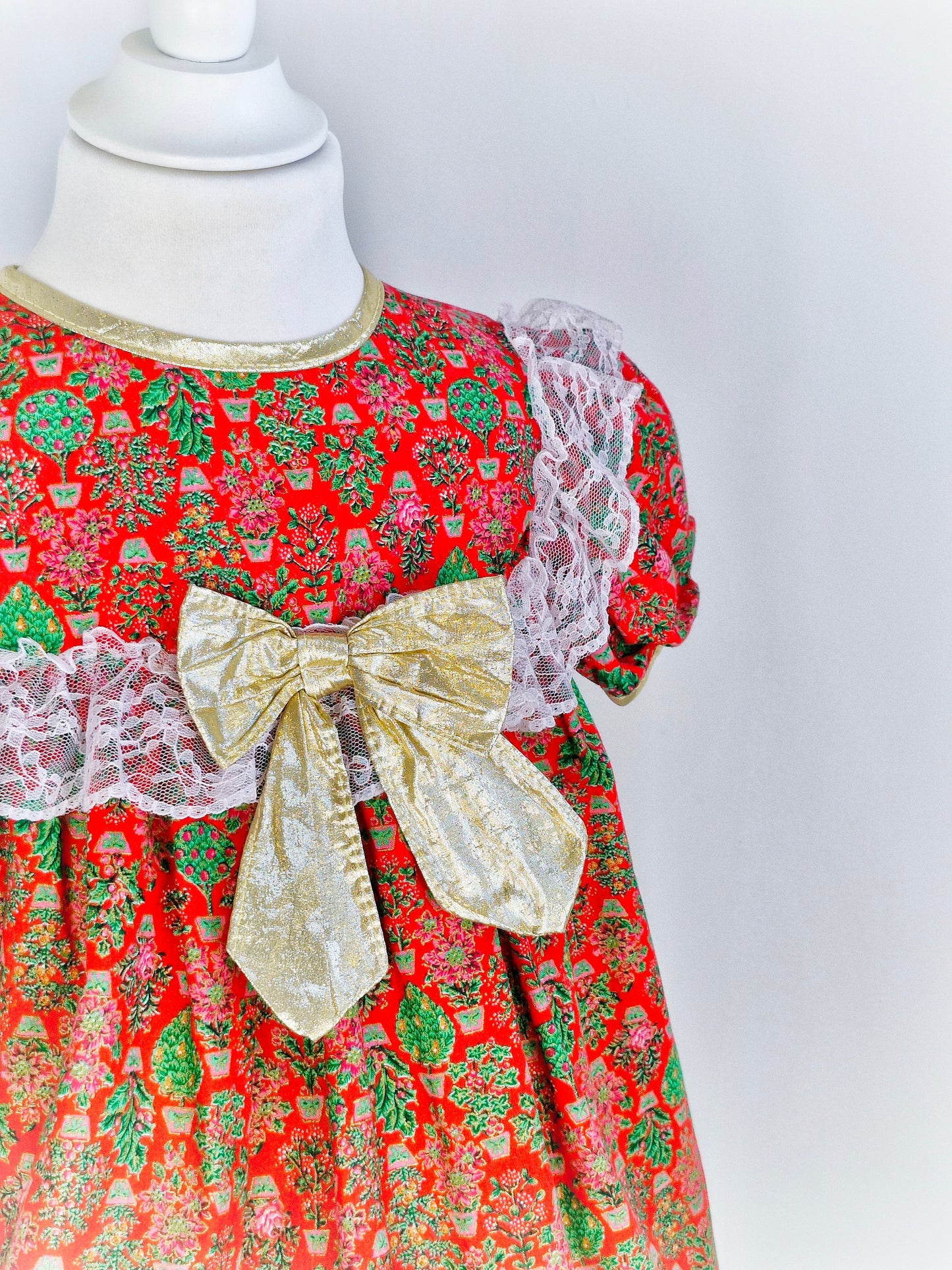 3-4 years. Red vintage Jill Lynn with gold bow and trim, white lace and Christmas tree print