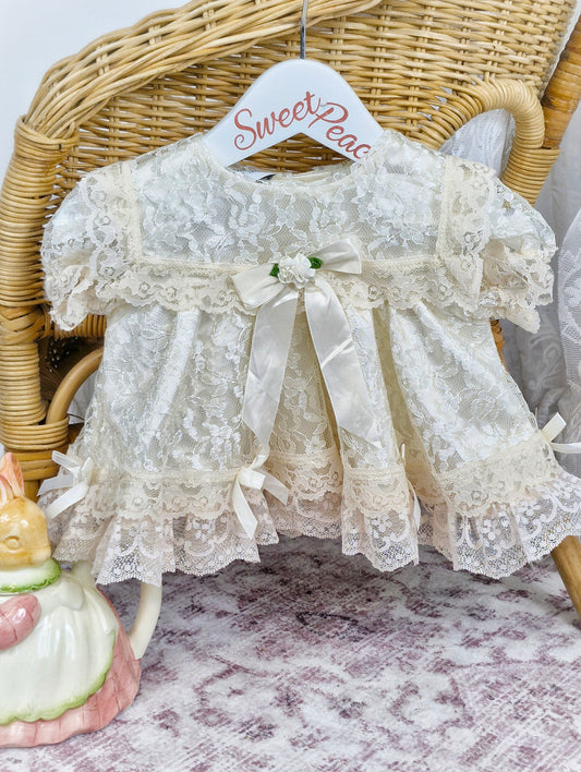 0-6 months Jolene. Off-white lace dress with ribbon