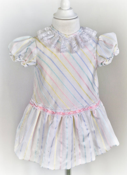 2-3 years. White dress with pastel stripes and lace collar
