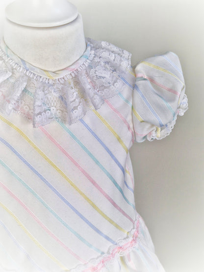 2-3 years. White dress with pastel stripes and lace collar