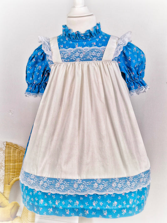 3-4 years. Blue floral Kawalla dress with attached white lace pinny