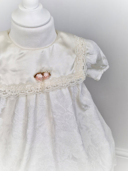 2 years. White Stone Gear dress with flowers, bib, lace and rosette. 1981.