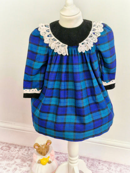 3 years. Blue, green and black tartan Emily Rose dress with crocheted details from 1961