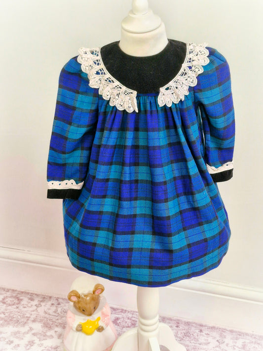 3 years. Blue, green and black tartan Emily Rose dress with crocheted details from 1961