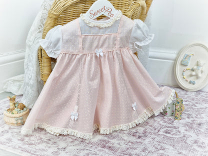 9-12 months. Pink and white polka dot dress with bows, 1960