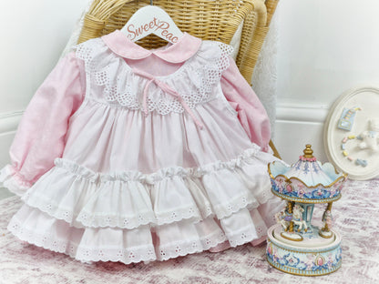 12 months. Pink Bryan dress with white floral print and apron