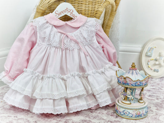 12 months. Pink Bryan dress with white floral print and apron