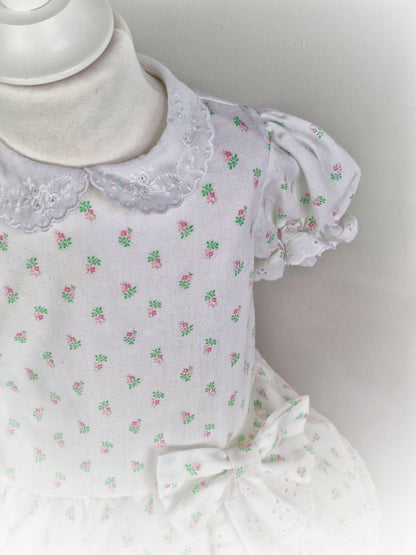 2 years. White dress from Sears with floral print and broderie anglais details